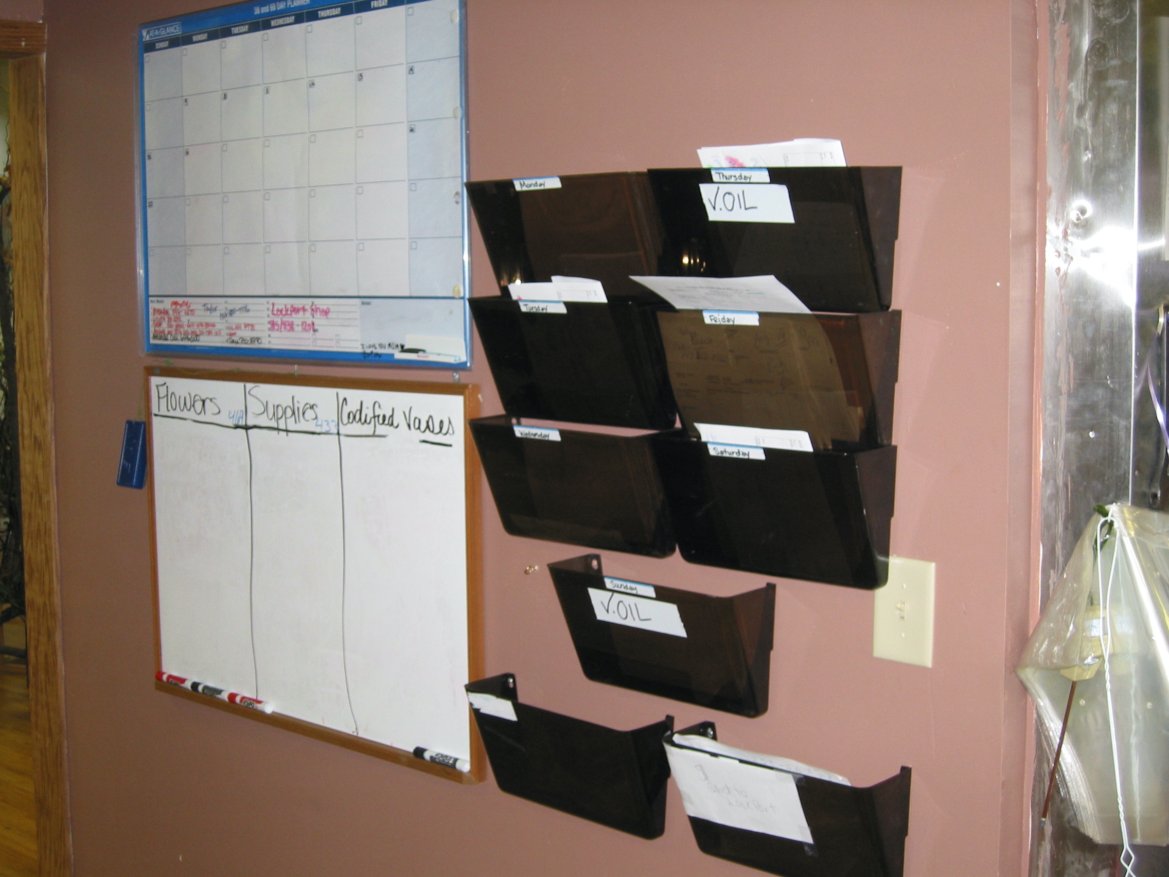 Photo of a makeshift calendar at a florist shop.